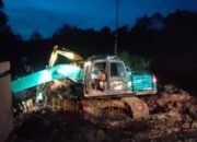 Satgas TMMD Kodim 1012/Buntok Lanjutkan Pekerjaan Jalan hingga Malam di Desa Talio